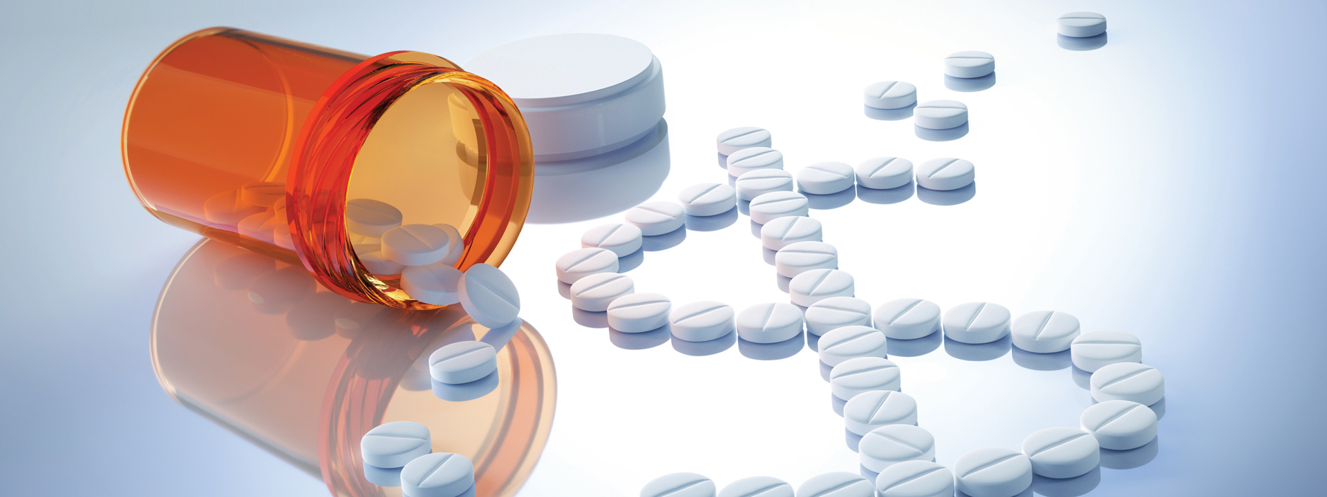 Pills spilling out of a pill bottle, forming a dollar sign